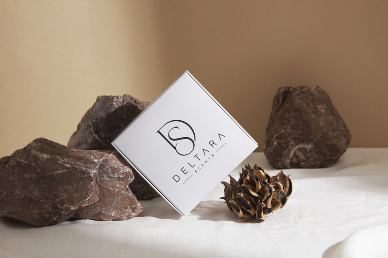 Deltara Scents packaging on stone