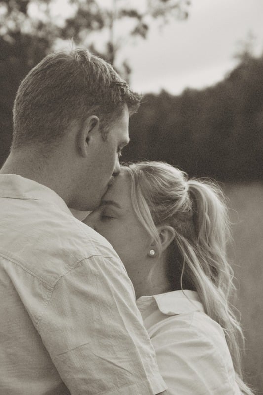 Couple sharing a kiss in soft light