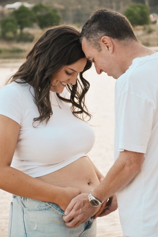 Couple holding the mother's bump