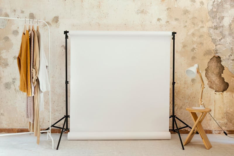 Studio set up with a cream backdrop and styling props